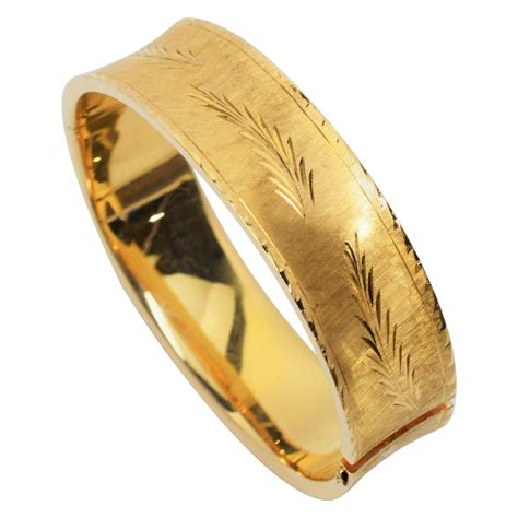 1940s French Wide Gold Bangle Bracelet With Engraved Floral Motif At