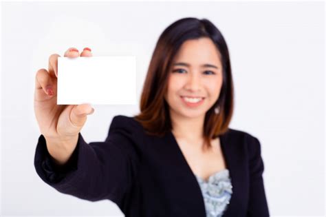 Woman shopping online with credit card and computer. Young woman holding mockup credit card in hand | Free Photo