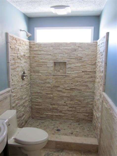 First, pick a color or pattern you'd like your bathroom to have, and incorporate the design into your shower. stacked rock wall tile | -stacked-stone-built-in-wall ...