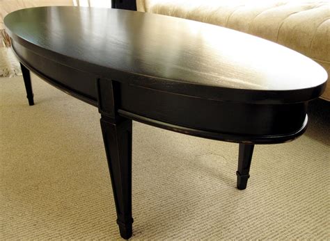 It's crafted with wood and edgy black metal for a. sweet tree furniture: black oval coffee table