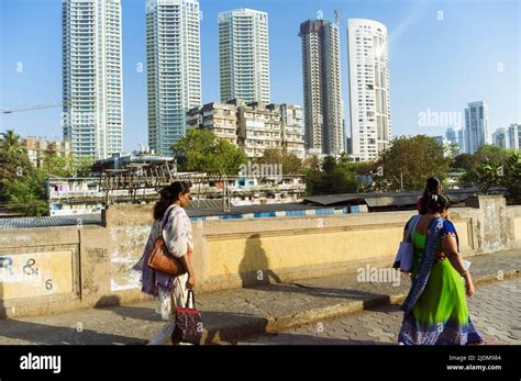Mumbai Maharashtra India Women Walk Past High Rise Buildings In