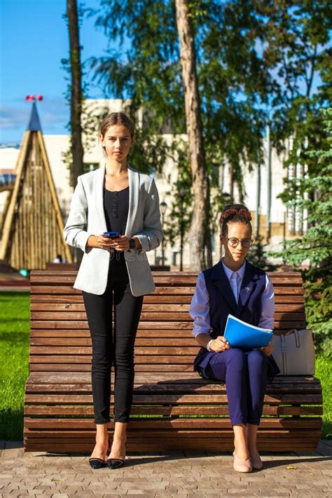 Two Young Female Students Met In A Summer Park Stock Image Image Of