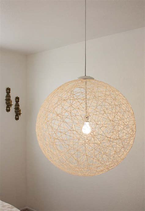 This three bulb hanging light fixture is mounted above our work table in the living room. 28 Dreamy DIY Lighting Projects You'll Adore