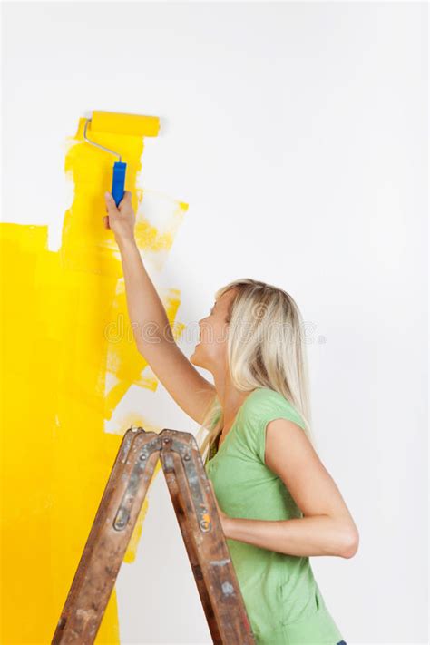 Woman Standing On A Ladder Painting Royalty Free Stock Photo Image