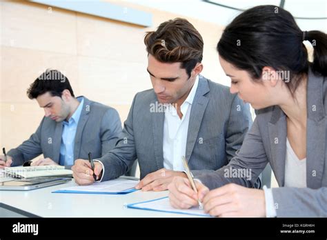 Young People Signing Application Form Stock Photo Alamy