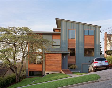 Exterior accessories such as light fixtures and house numbers can make a huge difference. Modern Remodel Of The Post War Split Level House Into A ...