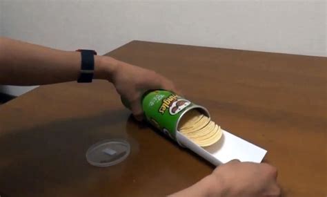 The Dead Simple Trick To Getting Chips Out Of A Pringles Can—fast