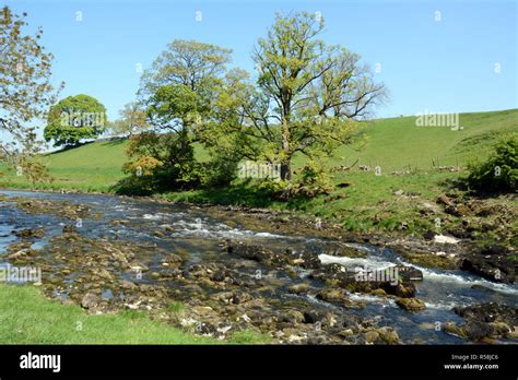 The Scenic Tree Lined Banks Of The River Wharfe Near Grassington