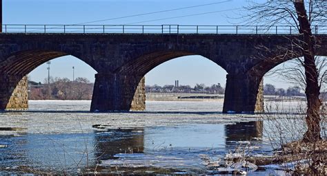 Looking Through Arches Of The Morrisville Trenton Railroad Bridge To