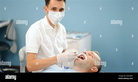 Dentist And Patient During An Orthodontic Treatment Stock Photo Alamy