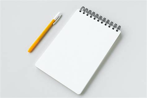 Blank Plain White Notebook With A Yellow Pen Premium Image By