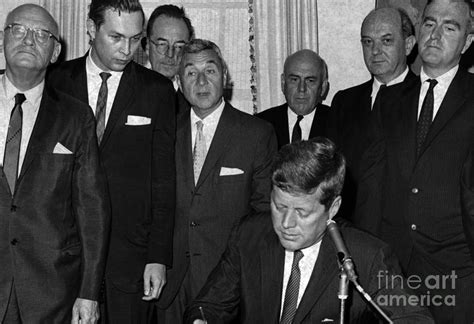 Supplies and such other officers as he may consider necessary or. Sen. John F. Kennedy signs the Arms Control and ...