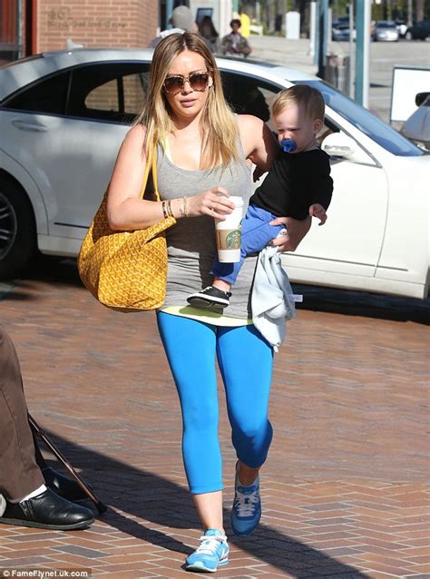 Hilary Duff As She Carries Little Luca In One Arm And A Heavy Bag On