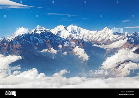 Snowy Mountains In Clouds Himalayas Mountain Ridge Ganesh Himal