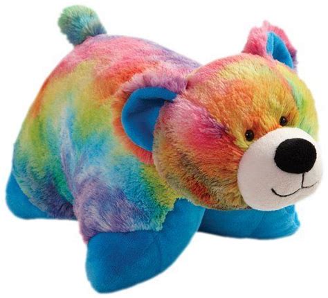 A Rainbow Colored Stuffed Animal Laying Down
