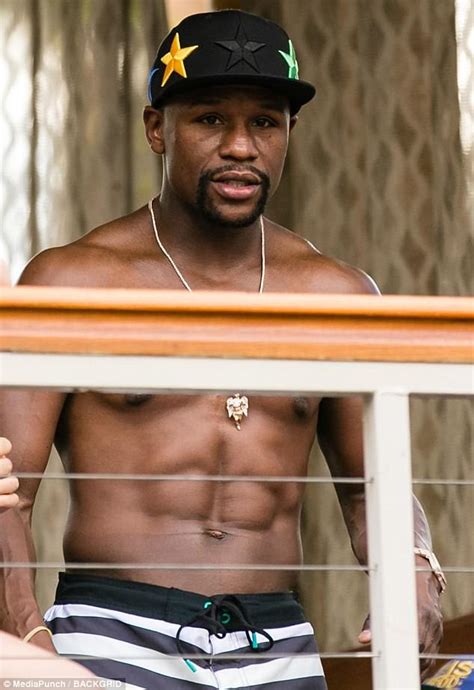 Big bottles for those big moments… Floyd Mayweather flaunts ripped physique in Las Vegas ...