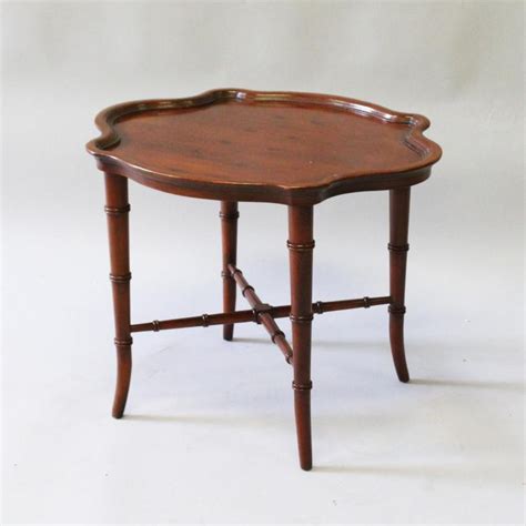 I thought it was brilliant. Sold Price: A SMALL MAHOGANY SHAPED TOP COFFEE TABLE on ...