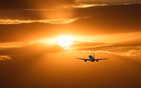 Plane Is Taking Off At Sunset Stock Photo Download Image Now Istock