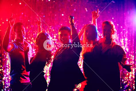 Group Of Happy Friends Dancing At Party In The Night Club Royalty Free