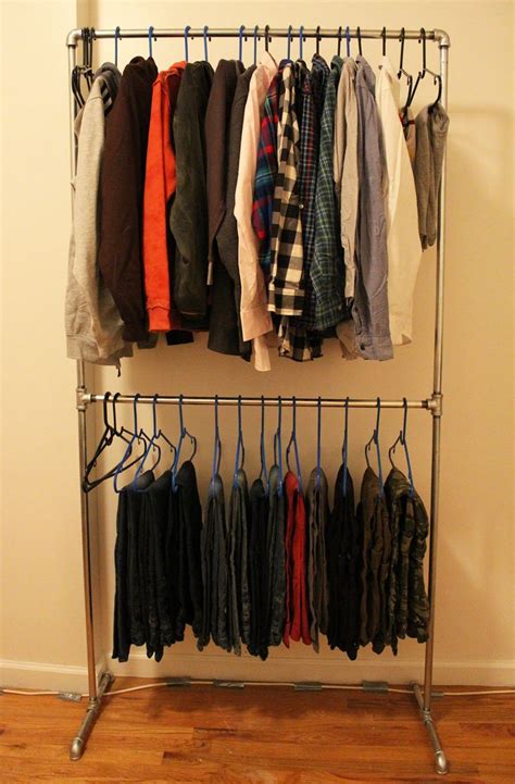 Build a durable dual rail clothes rack from pvc pipe, some mdf andassorted hardware store parts. DIY Pipe Clothing Rack