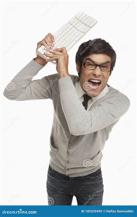 Angry Man Holding Up A Computer Keyboard Stock Image Image Of Anger