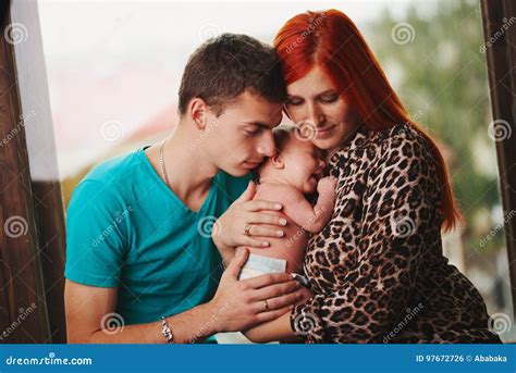 Happy Parents With Their Newborn Baby Stock Photo Image Of Copy