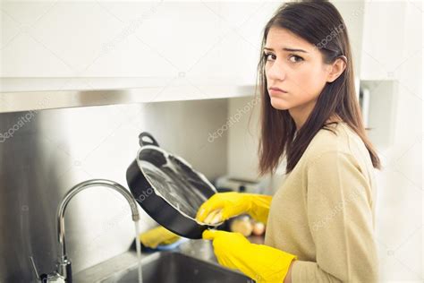 Hand Cleaningyoung Housewife Woman Washing Dishes In Kitchentired Of