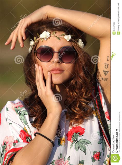 Girl Hippie In Sunglasses Looking At The Camera And