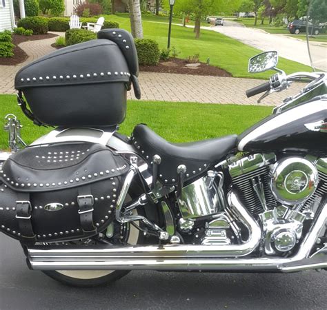It's loaded with chrome and includes classic hiawatha headlamps, brilliant laced wheels. 2006 Harley-Davidson® FLSTN/I Softail® Deluxe (Black And ...