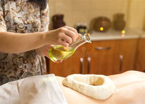 Woman In Wellness Spa Having Aroma Therapy Massage With Essential Oil