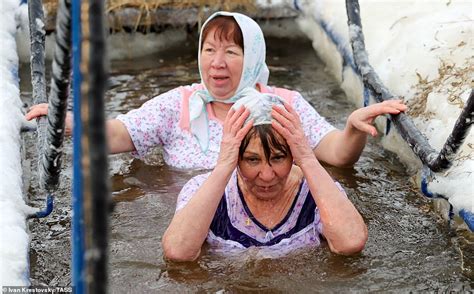 Orthodox Christians Plunge Into Icy Waters For Epiphany Celebration