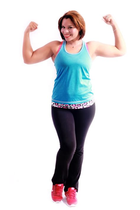 Smiling Woman Flexes Biceps Muscles