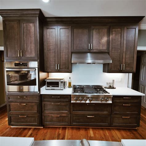 Dark cabinets w/ walnut floors kitchen design, pictures, remodel, decor and ideas Stain color: Dark Walnut. Our cabinets are 100% customized ...