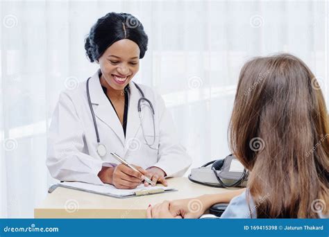 Black Female Doctor Consulting With European Patient About Her Health
