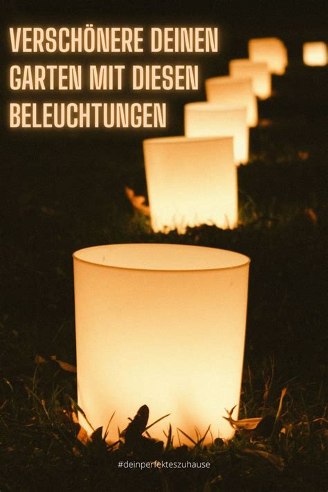 Several Lit Candles Sitting In The Grass At Night