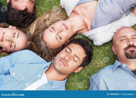 Group Of People Lying On Grass Taking A Nap Stock Image Image Of