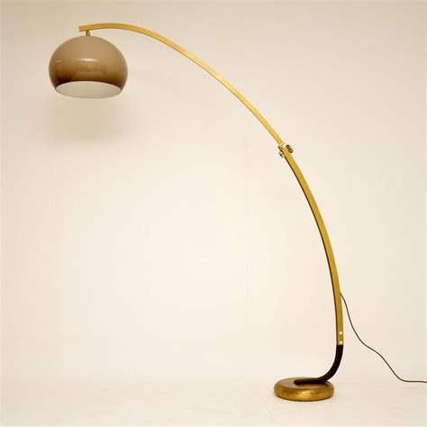 Oil brushed bronze floor lamp. 1960s Italian Vintage Extending Arc Floor Lamp at 1stDibs