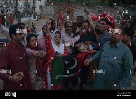 workers of pakistan peoples party ppp human rights wing offer sweets to each other after ppp