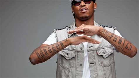 Download Future Rapper Pfp With Arm Tattoos Wallpaper