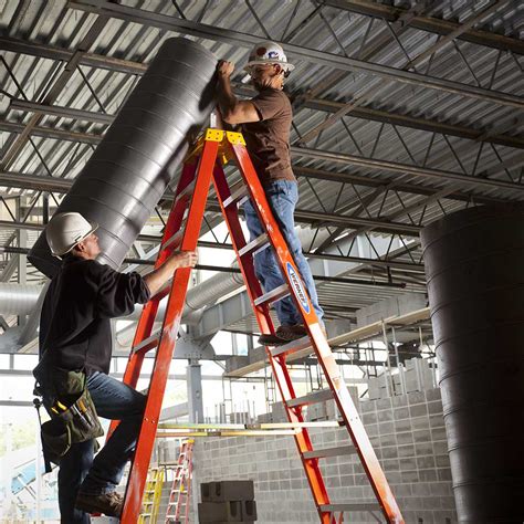 construction worker climbing ladder