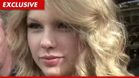 Taylor Swift Threatens Lawsuit Over Topless Photo