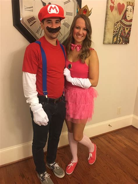 a man and woman are dressed up as mario and princess peach from mario kart