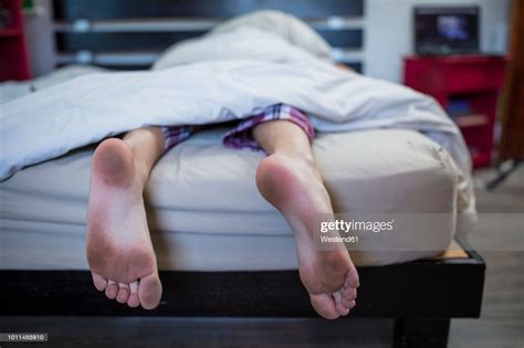 See over 707 dirty feet images on danbooru. Dirty Feet Of Boy Lying In Bed High-Res Stock Photo ...