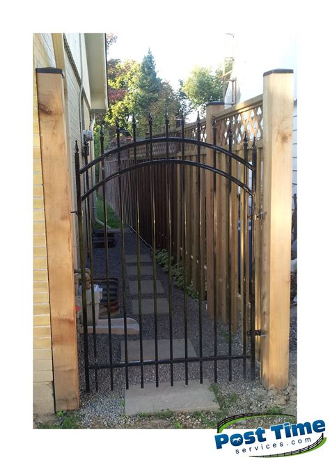 Arched Ornamental Gate Installed On 6x6 Cedar Posts With Nuvo Post Cap