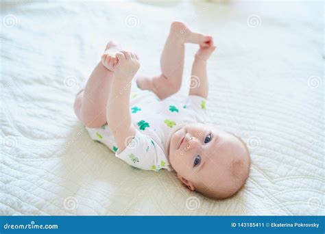 Cute Baby Girl Lying On Her Back Stock Image Image Of Grab Green
