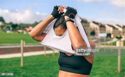 Woman Taking Her Clothes Off Bildbanksfoton Och Bilder Getty Images