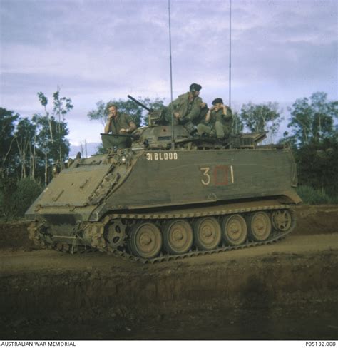 Three Australian Servicemen Aboard An M113a1 Armoured Personnel Carrier