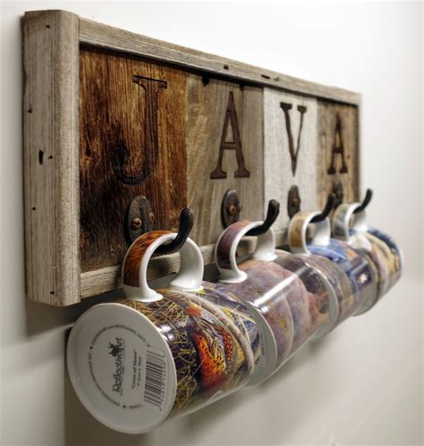 This wooden wall mounted coffee mug holder features 12 vintage style hooks to hang multiple cups, dish towels or coffee accessories. Barnwood Java Mug Rack Wall-Mount Cup Holder ⋆ AllBarnWood
