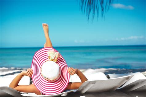 Free Photo Beautiful Woman Model Sunbathing On The Beach Chair In