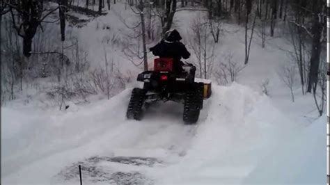 Atv With Tracks Plowing Onto Huge Snow Ramp Youtube